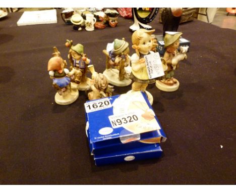 Seven Goebel figures and two Goebel miniature plates with stands 