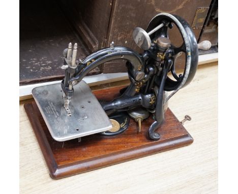 Two cased vintage portable sewing machines, Wilcox and Gibbs, 32cms wide
