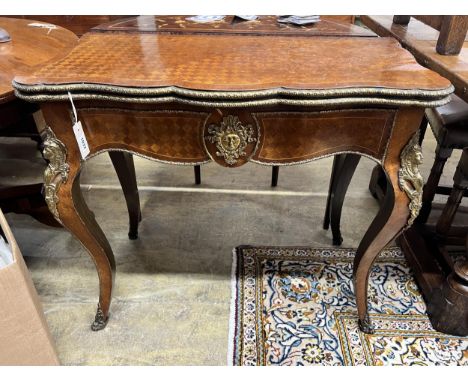 A French transitional style parquetry inlaid gilt metal mounted folding card table, width 85cm, depth 44cm, height 75cm