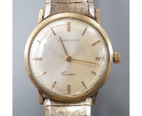 A gentleman's 9ct gold Longines Cosmic manual wind wrist watch, on associated flexible bracelet.