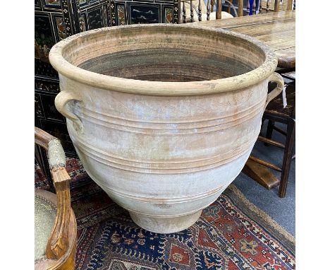 A large Grecian style circular earthenware garden planter diameter 80cm, height 80cm