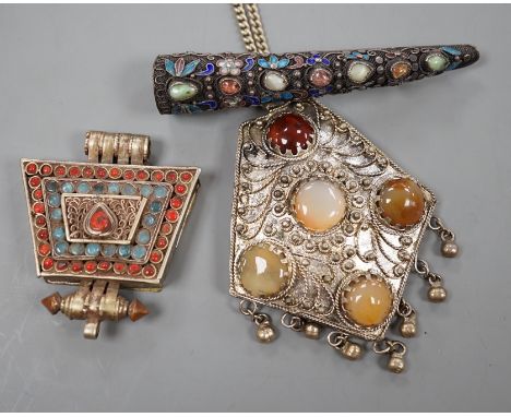 A Chinese filigree white metal, hardstone and enamel set nail guard, 86mm, together with two other Middle Eastern items.