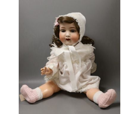 A Heubach Koppelsdorf bisque headed, open mouthed doll, 66cms long
