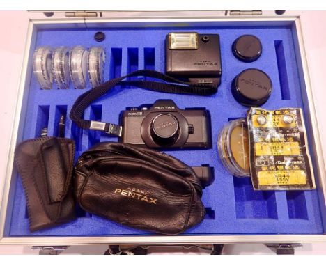 Pentax Auto 110 camera kit including camera body, additional lenses and filters within a fitted case. UK P&amp;P Group 2 (£20