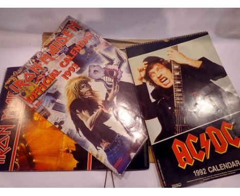 Four rock band calendars, Iron Maiden (2), AC/DC, and The Doors. UK P&amp;P Group 2 (£20+VAT for the first lot and £4+VAT for
