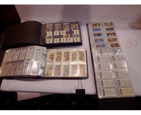 Three albums containing mixed cigarette, tea and sweet cards. UK P&amp;P Group 2 (£20+VAT for the first lot and £4+VAT for su