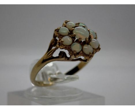 9ct gold cluster ring set with nine opals, size M, 1.8g. UK P&amp;P Group 0 (£6+VAT for the first lot and £1+VAT for subseque