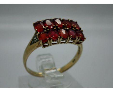 9ct gold ring set with rubies, size R, 2.7g. UK P&amp;P Group 0 (£6+VAT for the first lot and £1+VAT for subsequent lots) 