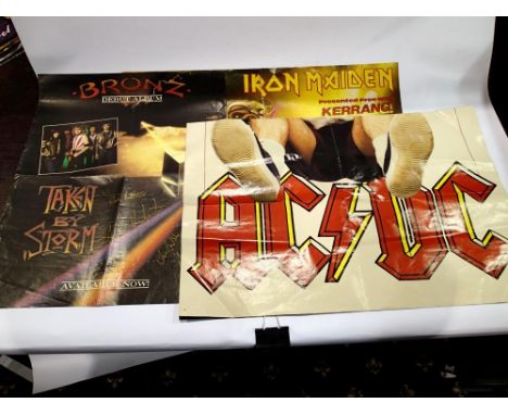 Seven Rock posters including a signed Bronz example, largest 42 x 64 cm. UK P&amp;P Group 2 (£20+VAT for the first lot and £4