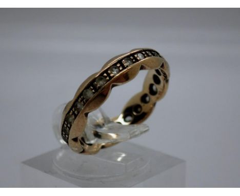 9ct gold eternity ring set with cubic zirconia, size M, 2.5g, lacking one stone. UK P&amp;P Group 0 (£6+VAT for the first lot