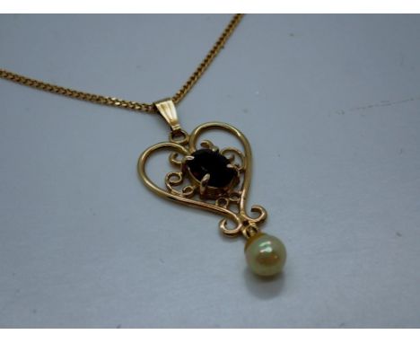 9ct gold pendant necklace set with garnet and seed pearl, pendant unmarked, L: 42 cm, 2.2g. UK P&amp;P Group 0 (£6+VAT for th