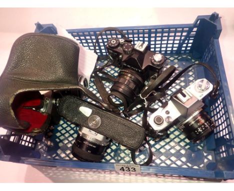 Three Topcon cameras, all firing, and a Zenit 12 XP. UK P&amp;P Group 3 (£30+VAT for the first lot and £8+VAT for subsequent 