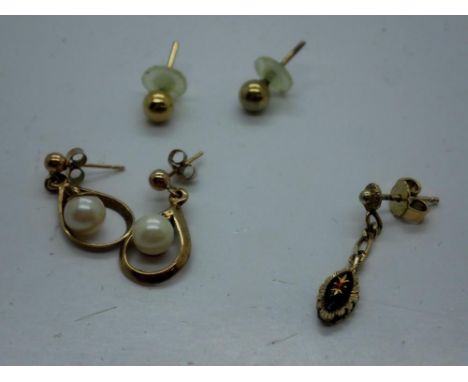 Pair of 9ct gold and pearl earrings, a pair of yellow metal stud earrings and a further yellow metal earring. UK P&amp;P Grou