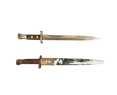 A Wilkinson of London WWII bayonet, with scabbard, and a WWII bayonet, without scabbard, both length 42.5cm (2).