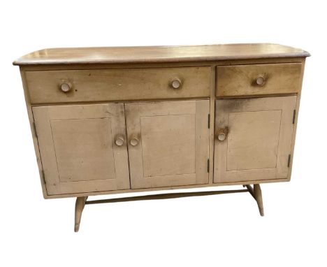 ERCOL; a mid century light elm sideboard, with two drawers above pair of cupboard doors, width 124cm.