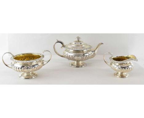 CHARLES BENDY; a late George III hallmarked silver three piece tea service comprising teapot, with part gadrooned body and fl