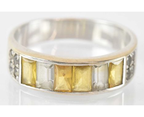 An 18ct white gold yellow sapphire and diamond set ring, size S, approx 5.4g, with original purchase receipt.