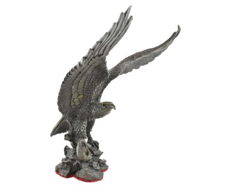 A modern bronze figure of a perched eagle, height 35cm.