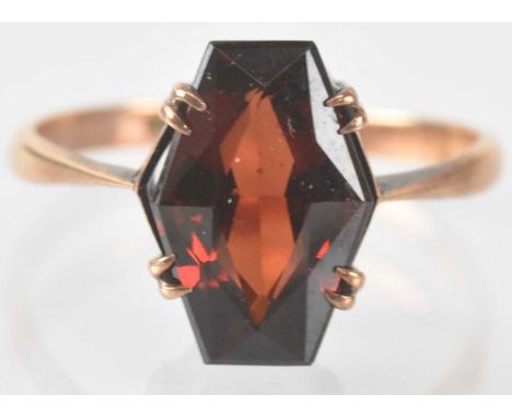 A 9ct yellow gold red stone set ring, size M, approx 1.9g.