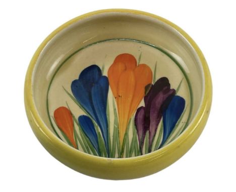 CLARICE CLIFF; a Bizarre painted pin dish, decorated in the 'Crocus' pattern, diameter 9cm.