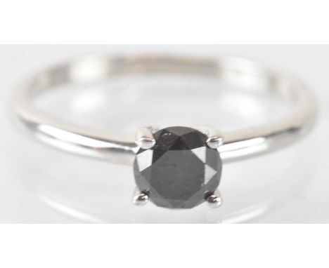 A 925 hallmarked silver black diamond solitaire ring, the round brilliant cut stone approx 1.2ct, size T/U, approx 2.7g, with