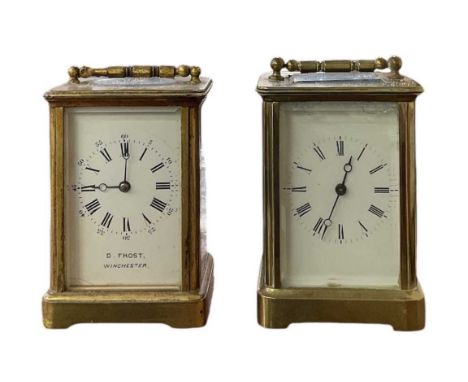 D. FROST OF WINCHESTER; a brass cased carriage clock, the white enamel dial set with Roman numerals and subsidiary seconds, h