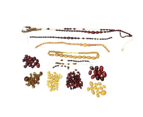 Various broken amber style necklaces and amber style loose beads, also two further amber style necklaces, one with 9ct gold r