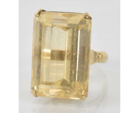 A 9ct yellow gold citrine set ring, the large citrine approx 2.5 x 1.7cm with a depth of approx 1cm, size M, approx 15.2g.