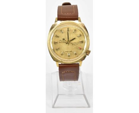 FEREL; a gentleman's vintage Electrotime Super Deluxe wristwatch, the golden face set with raised baton markers and red-tippe
