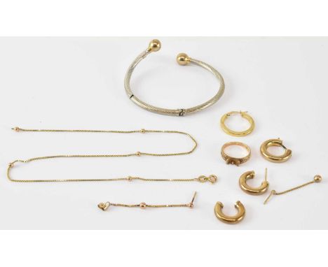 A 9ct yellow and white gold bangle, diameter 6cm, a pair of 9ct yellow gold hoop earrings, two further 9ct yellow gold earrin