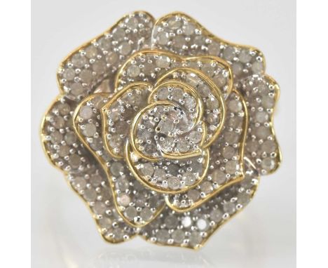 A 9ct yellow gold diamond set flower head ring, size R/S/, approx 9g, with certificate of authenticity.