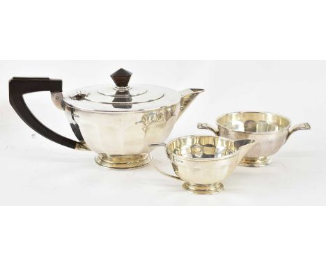 HENRY CLIFFORD DAVIS; a George V hallmarked silver three piece tea service comprising teapot, milk jug and twin handled sugar