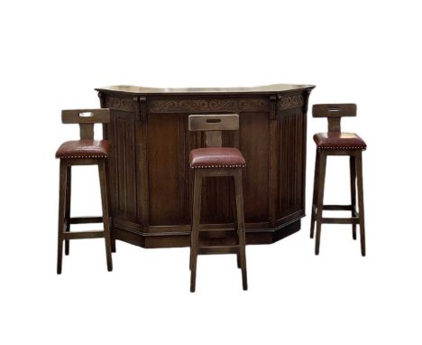 JAYCEE; a reproduction carved oak bar, with pair of cupboard doors and arrangement of shelves, width 154cm, depth 54cm, heigh