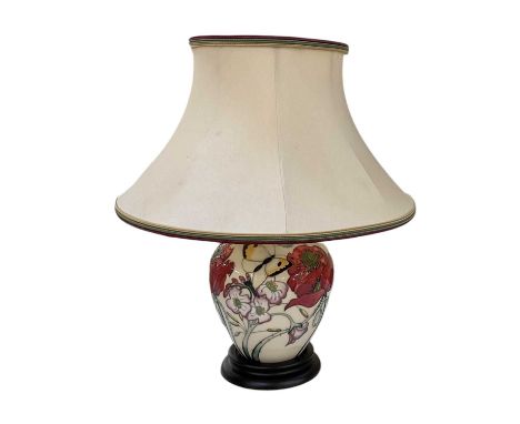 MOORCROFT; a white ground art pottery table lamp, decorated with butterflies amongst flowers, height to top of fitment 25cm, 