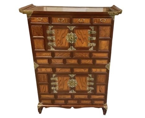 A modern Oriental multi-drawer tallboy (possibly Thai), height 137cm, width 103cm.