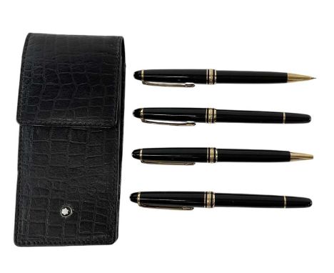 MONTBLANC; a fountain pen with 18ct white and yellow gold nib, matching ballpoint pen with lid, further matching ballpoint pe