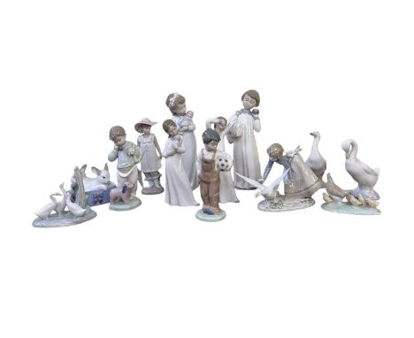 NAO; a collection of twelve porcelain figures including young boy with football, height 19cm, young girl with umbrella, heigh