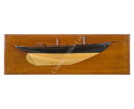 A FINE BUILDER'S HALF BLOCK MODEL FOR AN UNIDENTIFIED CRUISING YACHT, CIRCA 1895 carved in two sections of laminated pine, go