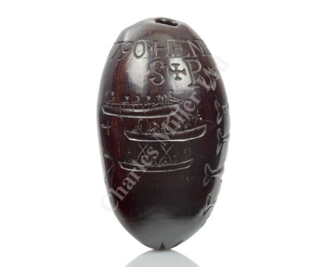 AN INTERESTING LATE 18TH CENTURY POLISHED 'BUG BEAR' NUT OF WHALING INTEREST carved overall with six whale profiles, a three-