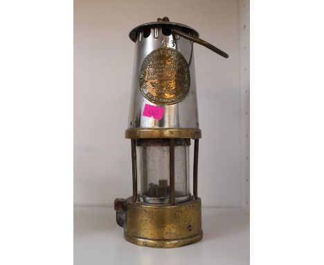 The Protector Lamp &amp; Lighting Co of Eccles no 43 miners lamp of Brass and Chrome construction 