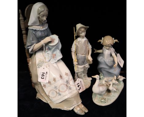 Large Lladro porcelain figure of a woman at her needlework, together with another little goose girl, printed marks. Together 