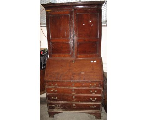 Early 19th Century Welsh oak two stage blind panelled bureau bookcase. Water damage, no reserve.(B.P. 24% incl. VAT)