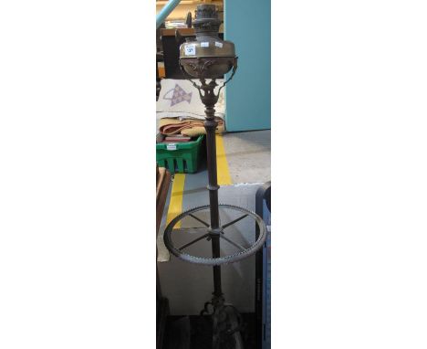 Brass oil lamp on telescopic stick stand type triform base. (B.P. 24% incl. VAT) 