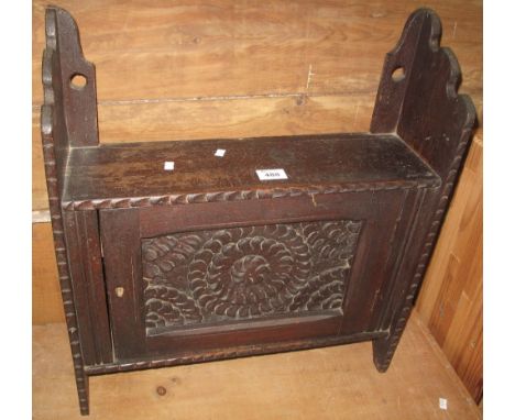 17th Century style carved oak single door blind panelled wall cabinet. (B.P. 24% incl. VAT)