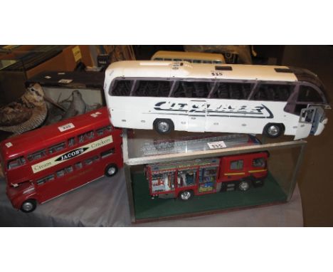 Model kit fire engine in glass case, together with a double decker bus and another bus marked City liner. (3)(B.P. 24% incl. 