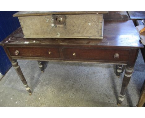 Victorian mahogany two drawer side table on ring turned legs and casters. Water damaged, no reserve.(B.P. 24% incl. VAT)