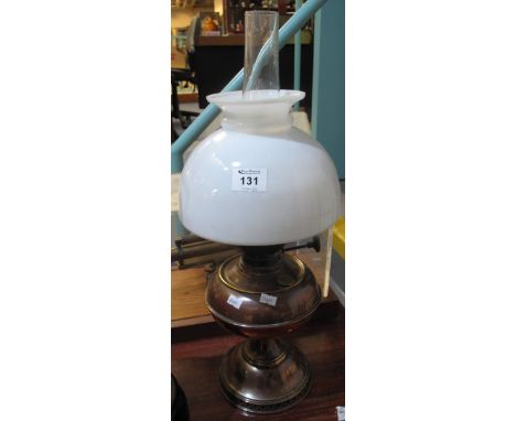 Brass pedestal oil lamp with baluster shape reservoir, opaque glass shade and chimney.(B.P. 24% incl. VAT)