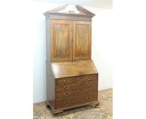 George III mahogany bureau bookcase with broken arch pediment, Greek key and blind fretwork, two panelled doors enclosing adj