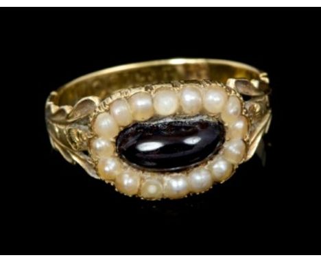 George IV gold (18ct) garnet and seed pearl cluster ring with an oval cabochon garnet surrounded by a border of seed pearls, 