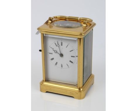 Late 19th century carriage clock with eight day movement, lever escapement striking on a bell, white enamel dial with Roman n